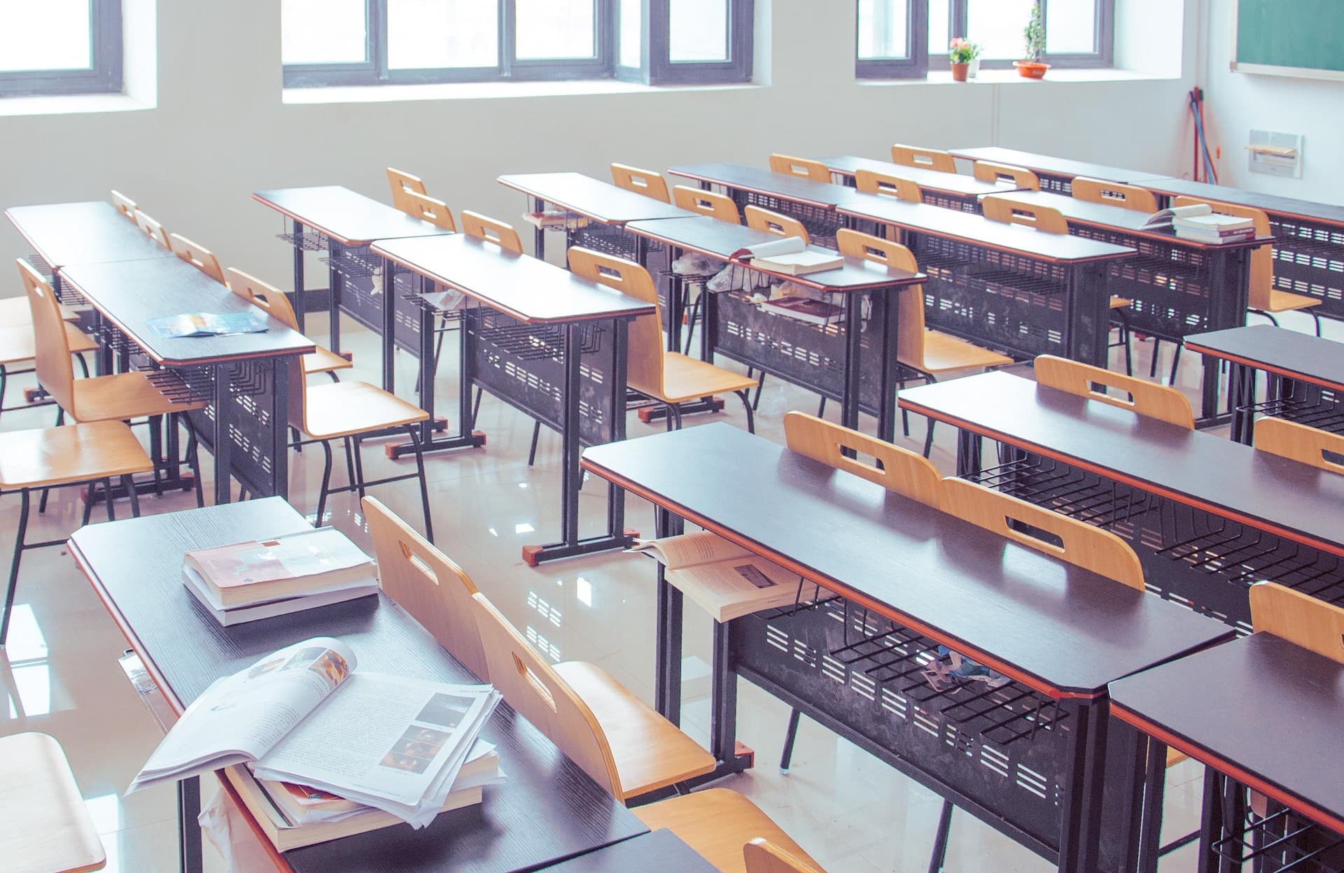 Bright classroom with desks and daylight